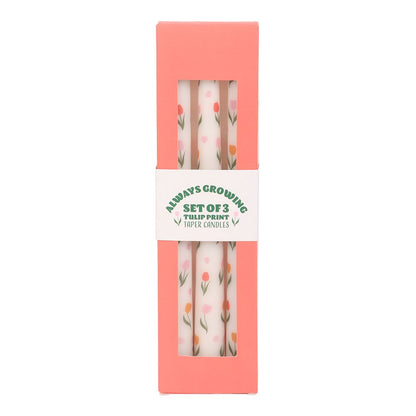 Set of 3 Shabbyquins tulip print taper candles in elegant holders on a decorative table.