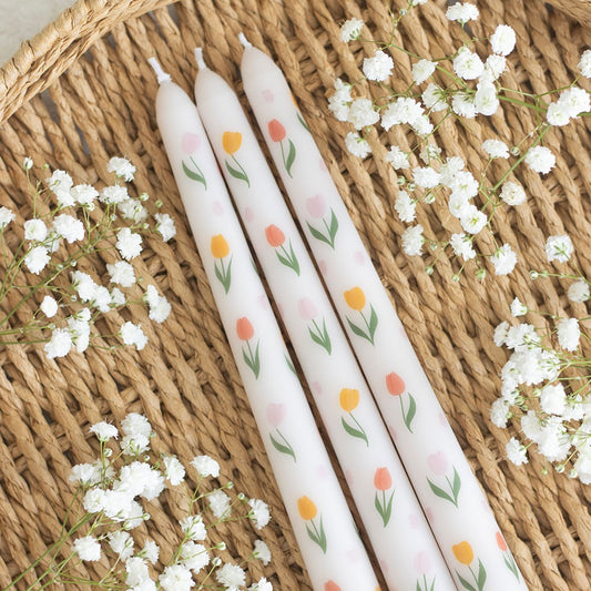 Set of 3 Shabbyquins tulip print taper candles in elegant holders, showcasing vibrant floral designs and warm candlelight.